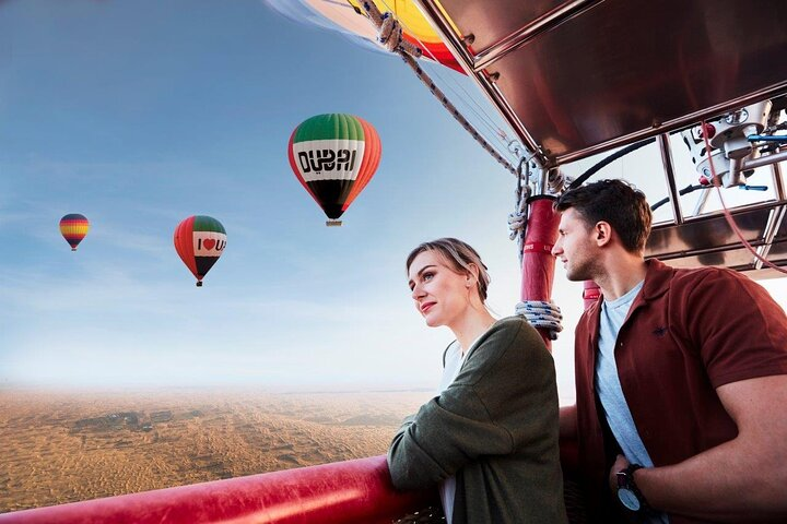 Experience the beauty of the Dubai desert at sunrise. Glide over sweeping sand dunes and spot wildlife while enjoying breathtaking views from your hot air balloon adventure.